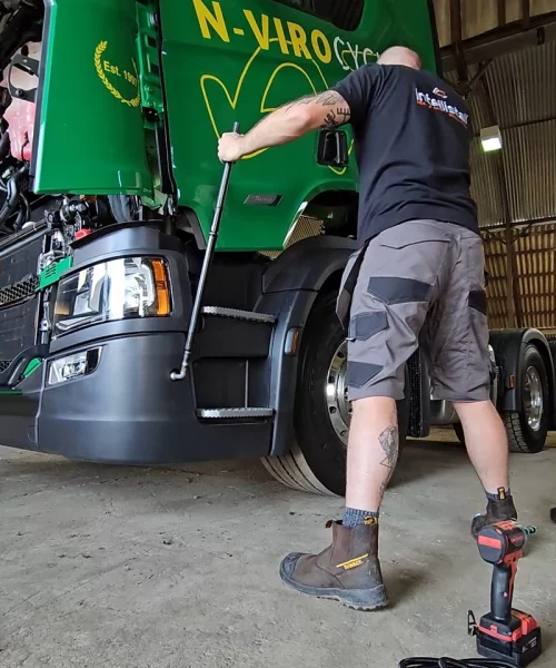 Engineer tilting cab during work